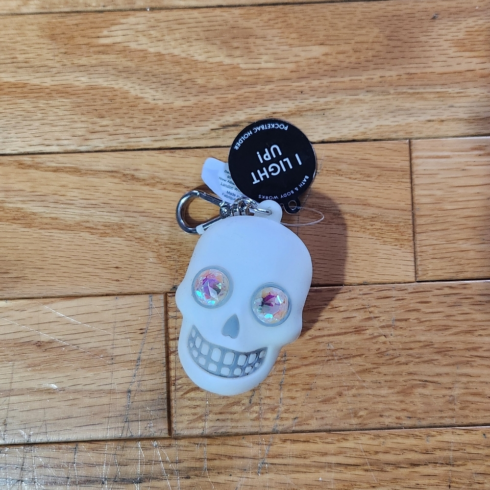 White Skull Keychain with Holographic Eyes Hand Sanitizer Holder Keychain